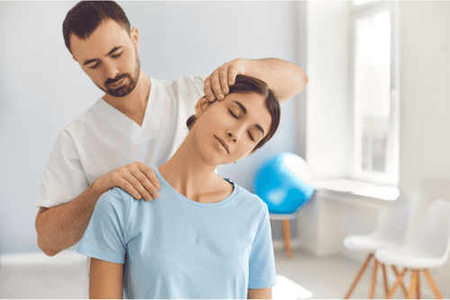 Chiropractic adjustment on a woman's neck